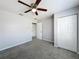 Bedroom features a window, closet doors, and carpeted flooring at 2203 San Vittorino Cir # 107, Kissimmee, FL 34741