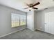 Bedroom has carpet flooring, a window, and a ceiling fan at 2203 San Vittorino Cir # 107, Kissimmee, FL 34741