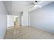 Bedroom with tiled floors, ceiling fan, and a closet at 2203 San Vittorino Cir # 107, Kissimmee, FL 34741