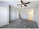 Neutral bedroom leads to the bathroom through an open doorway at 2203 San Vittorino Cir # 107, Kissimmee, FL 34741