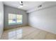 Spacious bedroom with neutral walls, tile flooring, and a ceiling fan at 2203 San Vittorino Cir # 107, Kissimmee, FL 34741