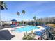 Inviting community pool with lounge chairs, playground and lush landscaping at 2203 San Vittorino Cir # 107, Kissimmee, FL 34741