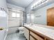 Bathroom showcasing a shower and tub combo, white tiling, and a modern vanity at 3039 China Berry Ct, Kissimmee, FL 34746