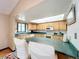 Bright kitchen features lots of cabinets, spacious countertop and views into the dining area, perfect for entertaining at 3039 China Berry Ct, Kissimmee, FL 34746