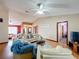 Bright living room features vaulted ceilings, wood floors, and comfortable seating area, perfect for relaxation at 3039 China Berry Ct, Kissimmee, FL 34746