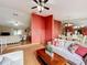 Bright living area with wood floors, open layout, connected to dining, creating seamless flow throughout the home at 3039 China Berry Ct, Kissimmee, FL 34746