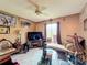 Cozy living room featuring unique decor and a comfortable window seat for relaxation at 3039 China Berry Ct, Kissimmee, FL 34746