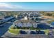 Aerial view of the community, showing condo buildings, parking, and the surrounding landscape at 361 Annabelle Way, Davenport, FL 33837