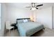 Bedroom featuring a comfortable bed, ceiling fan, and natural light at 361 Annabelle Way, Davenport, FL 33837