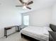 Bedroom featuring a large window, ceiling fan, desk, and comfortable bed at 361 Annabelle Way, Davenport, FL 33837