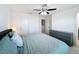 Spacious bedroom with a ceiling fan, dresser, and ample closet space at 361 Annabelle Way, Davenport, FL 33837