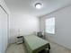 Bright bedroom with a twin bed, desk, and closet for ample storage at 361 Annabelle Way, Davenport, FL 33837