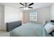 Comfortable bedroom with large window, ceiling fan and dresser at 361 Annabelle Way, Davenport, FL 33837