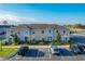 Well-maintained two-story condo building with landscaped grounds and ample parking spaces at 361 Annabelle Way, Davenport, FL 33837