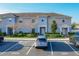 Charming condo exterior with tidy landscaping and convenient parking near the building entrance at 361 Annabelle Way, Davenport, FL 33837