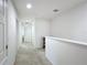 Bright upstairs hallway featuring fresh paint and easy access to bedrooms and bathrooms at 361 Annabelle Way, Davenport, FL 33837