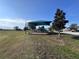 A colorful community playground with a sunshade, climbing structure and slide offers a shady play area at 361 Annabelle Way, Davenport, FL 33837
