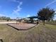 A vibrant community playground area featuring swings, slides, and benches for a fun outdoor experience at 361 Annabelle Way, Davenport, FL 33837