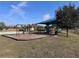 A vibrant community playground area featuring swings, slides, and benches for a fun outdoor experience at 361 Annabelle Way, Davenport, FL 33837
