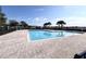 A refreshing community pool with clear blue water and a spacious deck for lounging and relaxation at 361 Annabelle Way, Davenport, FL 33837