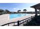 A refreshing community pool with clear blue water and a spacious deck for lounging and relaxation at 361 Annabelle Way, Davenport, FL 33837