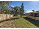 The backyard features a shed, wood fence, and room to roam at 3827 Anna Dr, Apopka, FL 32703