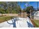 Fenced backyard featuring a storage shed, concrete patio, and grassy area at 3827 Anna Dr, Apopka, FL 32703