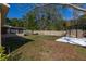 A spacious yard with a storage shed, green grass, and a fenced yard at 3827 Anna Dr, Apopka, FL 32703