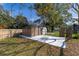 A large backyard storage shed, concrete pad and partial fencing visible at 3827 Anna Dr, Apopka, FL 32703
