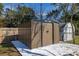 Large backyard storage shed and concrete pad. Partial fencing visible at 3827 Anna Dr, Apopka, FL 32703