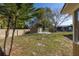 The backyard features a storage shed, wood fence, and shade trees at 3827 Anna Dr, Apopka, FL 32703
