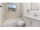 Well-lit renovated bathroom features a tub, sleek vanity, and updated fixtures at 3827 Anna Dr, Apopka, FL 32703