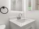 Updated bathroom features a modern vanity with a sleek mirror and fixtures at 3827 Anna Dr, Apopka, FL 32703