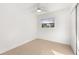Bright bedroom features neutral tile flooring, a ceiling fan, and a spacious closet at 3827 Anna Dr, Apopka, FL 32703