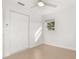 Bright bedroom features neutral tile flooring, a ceiling fan, and a spacious closet at 3827 Anna Dr, Apopka, FL 32703