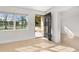 Bright entryway featuring neutral tile flooring, a modern front door, and ample natural light at 3827 Anna Dr, Apopka, FL 32703