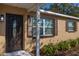 Close-up of the home's entrance, showing the front door, shutters, and house number at 3827 Anna Dr, Apopka, FL 32703
