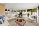 Furnished lanai features comfortable seating and natural light at 3827 Anna Dr, Apopka, FL 32703