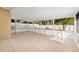 Enclosed lanai features tile flooring, screen windows, and access to backyard at 3827 Anna Dr, Apopka, FL 32703