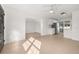 Open-concept living area with tile floors connecting the living room to the updated kitchen at 3827 Anna Dr, Apopka, FL 32703