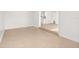 Open floor plan featuring neutral tile flooring leading from living area to kitchen at 3827 Anna Dr, Apopka, FL 32703