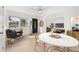 Inviting living room with tile flooring, a ceiling fan, and seamless flow to adjacent rooms at 3827 Anna Dr, Apopka, FL 32703