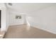 Bright living room features neutral tile flooring and a window providing ample natural light at 3827 Anna Dr, Apopka, FL 32703