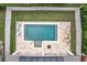 Aerial view of a pool, backyard, and patio with fencing at 3857 San Isidro Cir, St Cloud, FL 34772