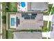 Aerial view of house featuring solar panels, pool, backyard and a fenced in yard at 3857 San Isidro Cir, St Cloud, FL 34772
