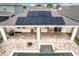 Gorgeous backyard with a sparkling pool, outdoor kitchen, and solar panels on roof at 3857 San Isidro Cir, St Cloud, FL 34772