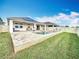 Large backyard featuring a pool and brick-paved pool deck at 3857 San Isidro Cir, St Cloud, FL 34772