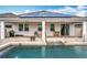 Backyard featuring a pool with a brick-paved pool deck and a covered patio at 3857 San Isidro Cir, St Cloud, FL 34772