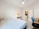 The bedroom is carpeted, and features a fan, a desk and chair, plus a bed at 3857 San Isidro Cir, St Cloud, FL 34772