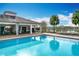 Beautiful pool and clubhouse overlooking pond within the community at 3857 San Isidro Cir, St Cloud, FL 34772